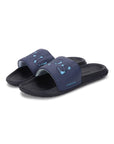 Pair of navy blue slides with black soles on a white background