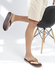 Styled shot: brown V-strap flipflops paired with shorts.