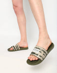 Men’s printed strap sliders in olive green paired with shorts