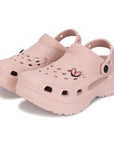 Pair of light pink clogs with breathable vent design ,Lightweight and flexible .