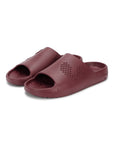 Pair of maroon Chupster with dotted pattern on a white background