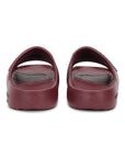Foot POV pair of maroon Chupster on a white background