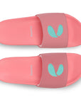 Pair of pink slides with a logo on a white background