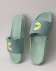 Pair of light blue slides with yellow accents on a light gray background