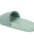 Light green slide sandal with 'Chumps' branding on a white background