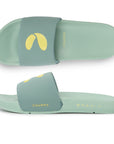 Pair of light green slides with a yellow logo on a white background