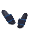 Sporty men’s sliders in blue with silicon embossed upper , a tilted picture