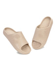 Pair of Dark vanilla open-toe Chupster on a white background