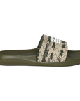 A pair of olive green and white sliders with the brand 'CHUPPS' written on the strap.