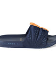 A navy blue slipper with a foldable upper stitch design and orange detailing around the ankle area, featuring a navy blue sole with branding on the side.