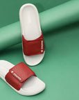 Comfortable men’s Velcro sliders in maroon by Chupps on a green background