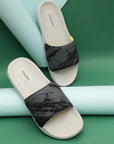 Casual look featuring grey sliders resting on green colour craft paper