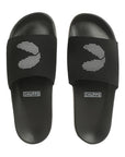 A pair of black men's slippers with signature 'C' in a white colour dotted pattern on top of strap around the ankle.