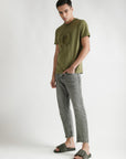 Styled photo: sliders with casual denims and green t-short for everyday wear.