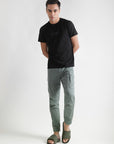 black & olive sliders paired with cargo pants and black t-shirt for a casual look