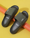 Solid Hues black & olive sliders top view showing olive upper and black sole.