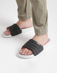 Close-up of feet showing cushioned footbed and slip-resistant sole