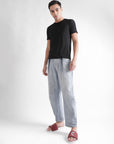 Dot fusion sliders paired with light blue loose fit denims and solid black T-shirt