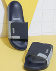 Dynamic view of navy & grey sliders highlighting adjustable Velcro strap.