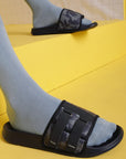 Close-up of ErgoX Plus footbed and FOAM6 padded strap for cushioning paired with grey socks for the comfy look