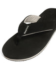 close up of black V-strap flipflops highlighting neoprene toe post.