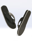 Side profile of black V-strap flipflops highlighting neoprene toe post.