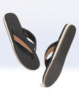 Dynamic view of dark brown & black flipflops highlighting neoprene toe post.