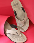Slippers styled on a red background