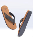 X-Flex tan & blue V-strap dynamic view showing URO Foam footbed and grippy sole.