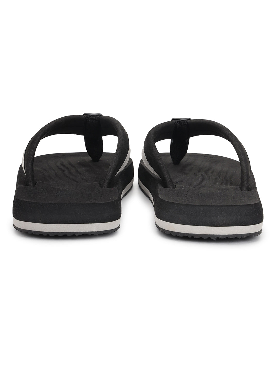 Holt sandals placed casually on a tiled floor
