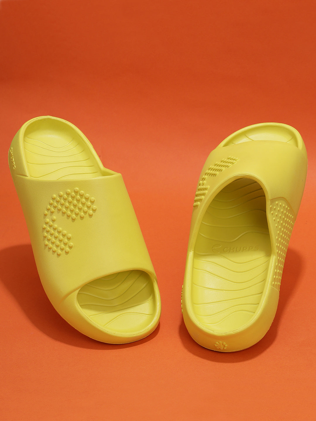 Pair of yellow Chupster on an orange background