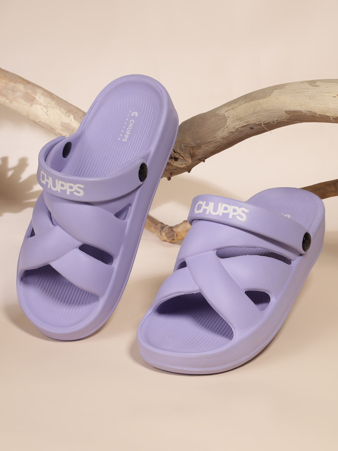Purple clogs with sleek design on beige background