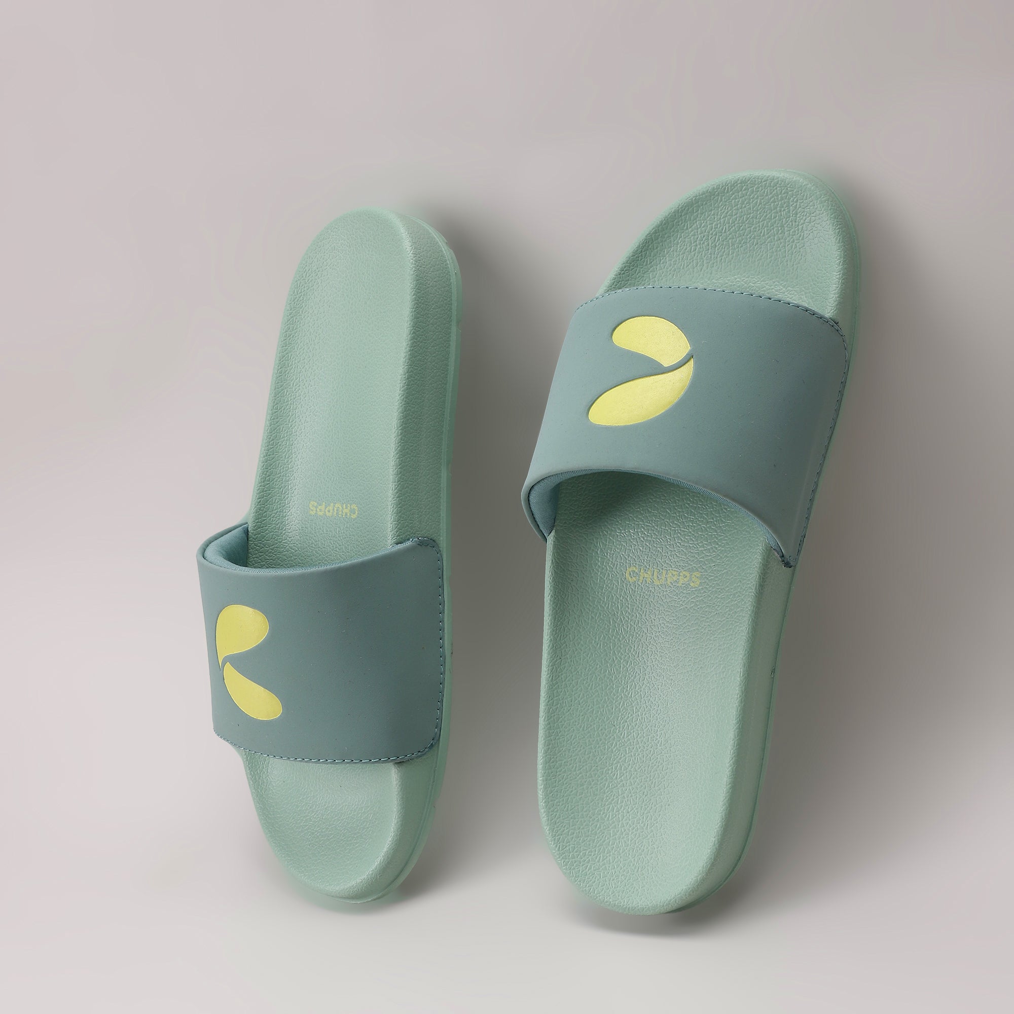 Pair of light blue slides with yellow accents on a light gray background