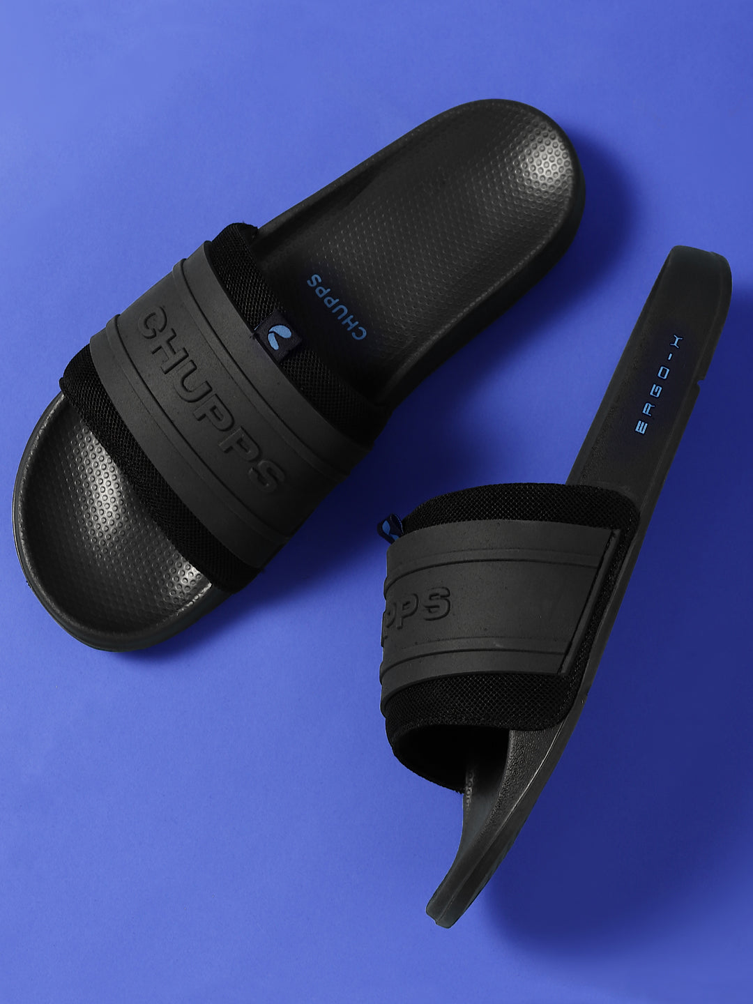 Sporty men’s black sliders with silicon embossed upper on a blue background