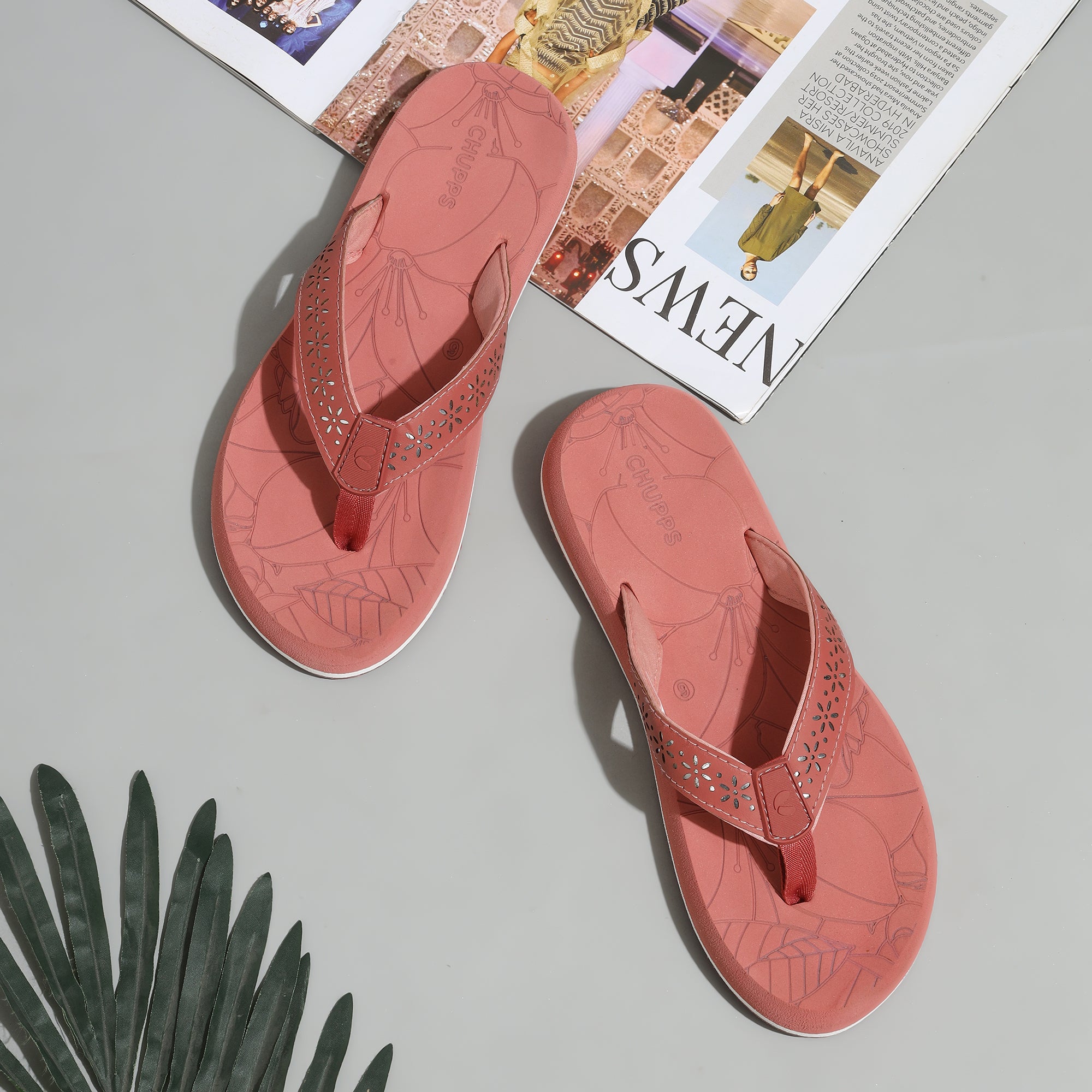 Peach flip-flops for women top view with floral flip-flop