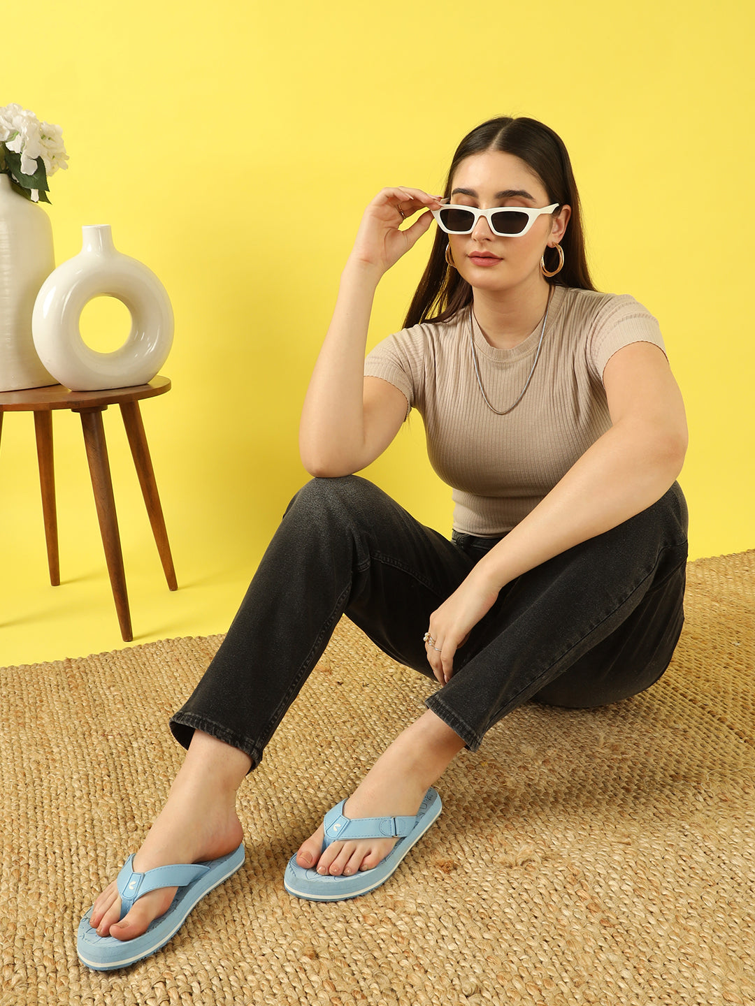 Girl wearing sky blue casual flip-flops  by Chupps