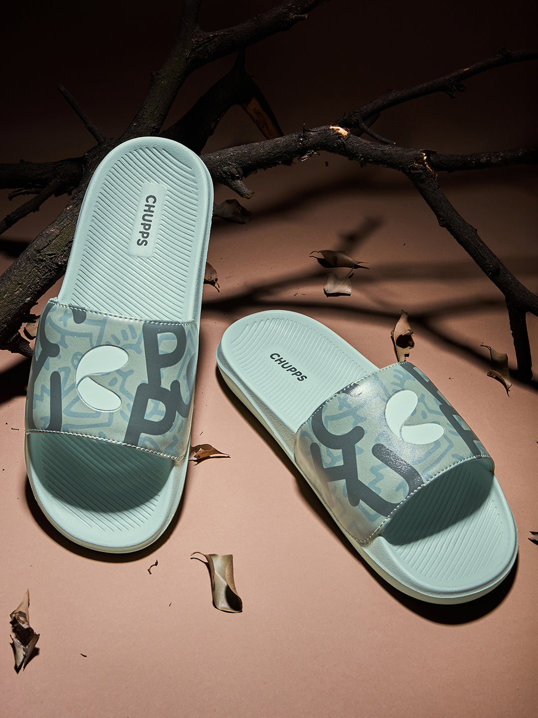 Chupps Tumble men’s slider with dark green strap and light green sole in playful, modern design which is comfortable sliders for casual streetwear.