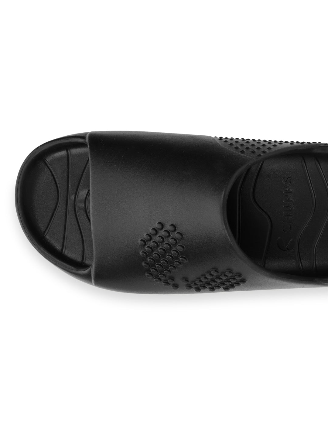 Black slip-on shoe with textured sole on a white background