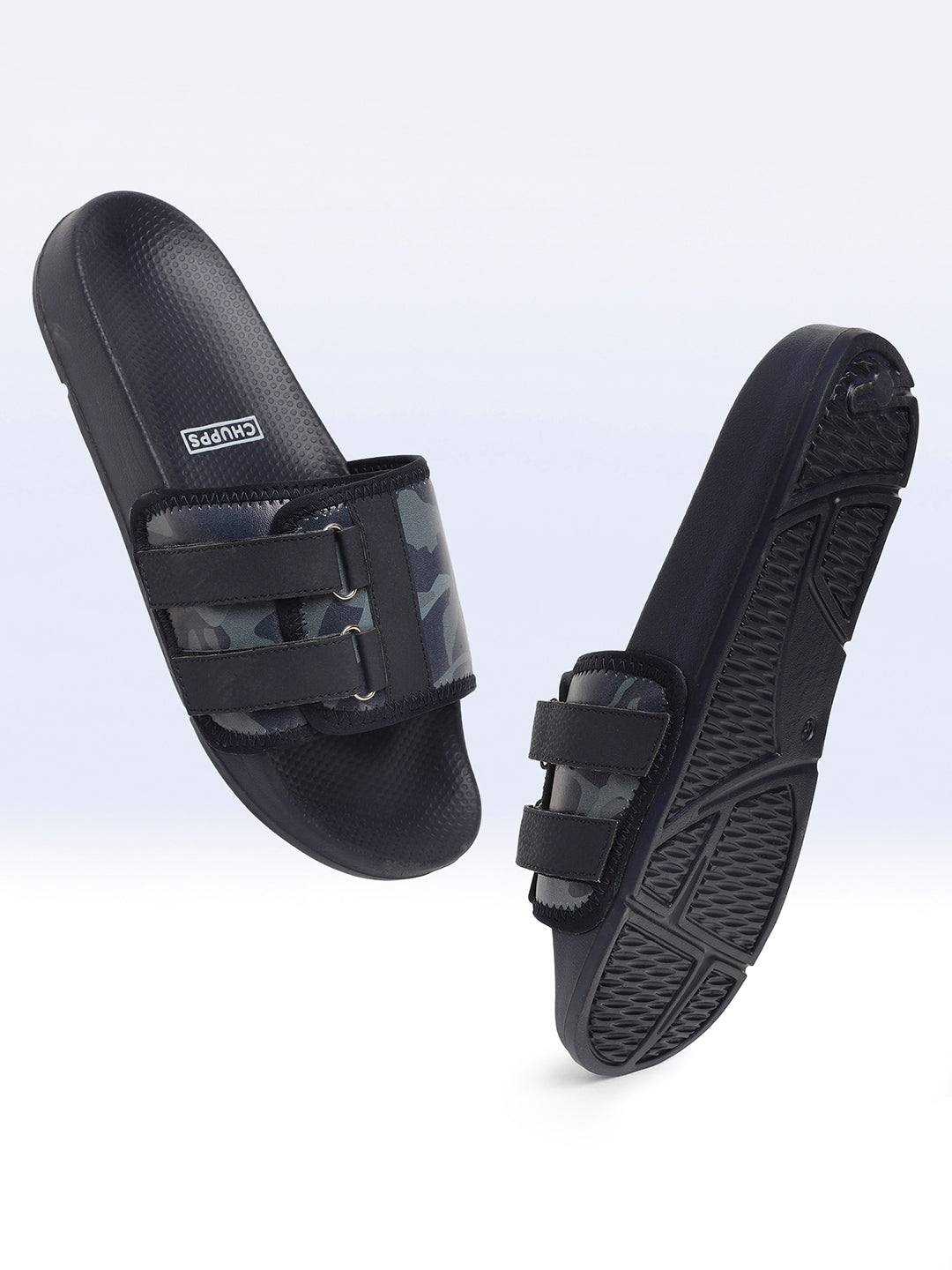 Dynamic view of navy blue camo sliders highlighting adjustable Velcro strap.