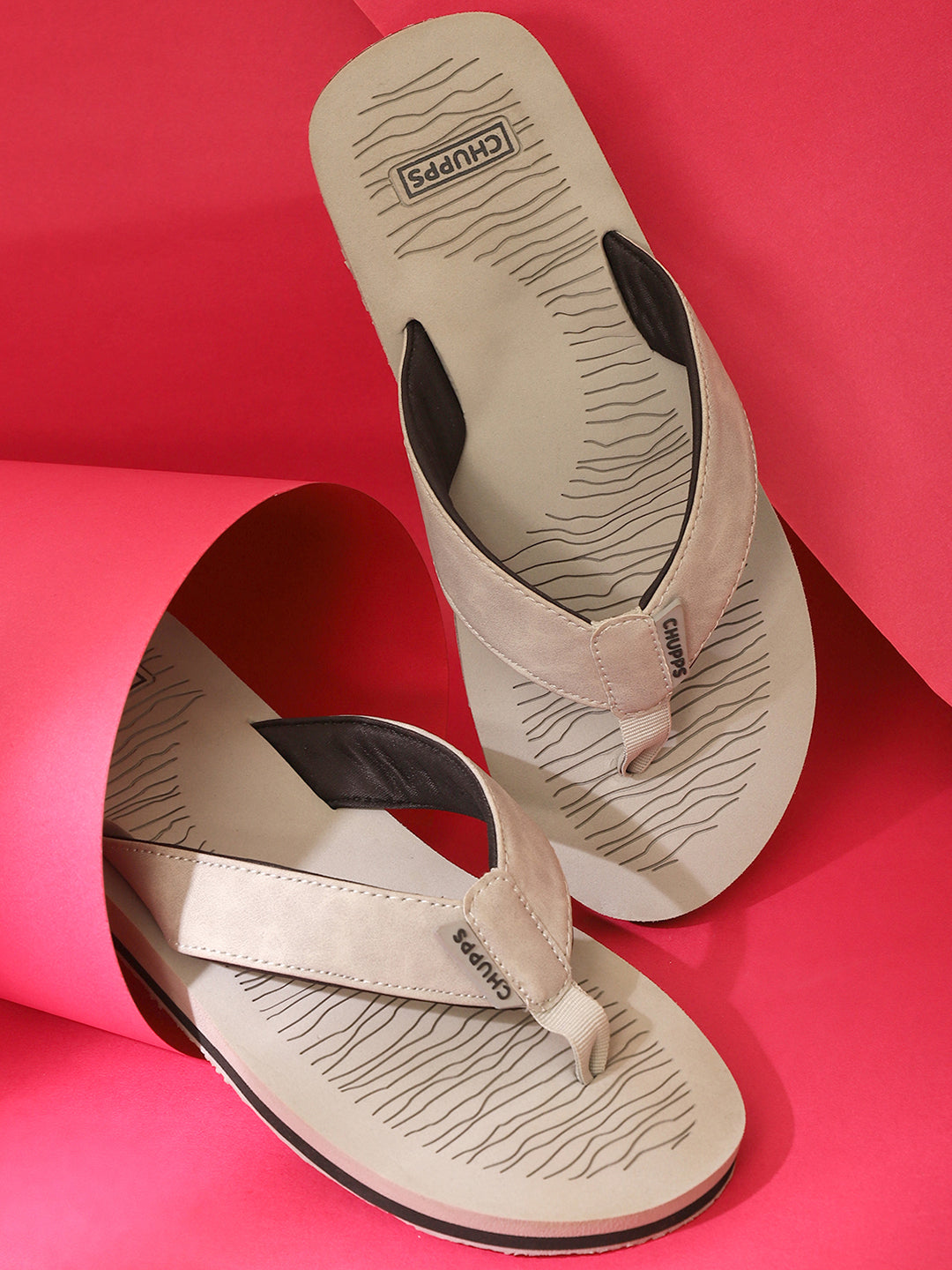 Slippers styled on a red background