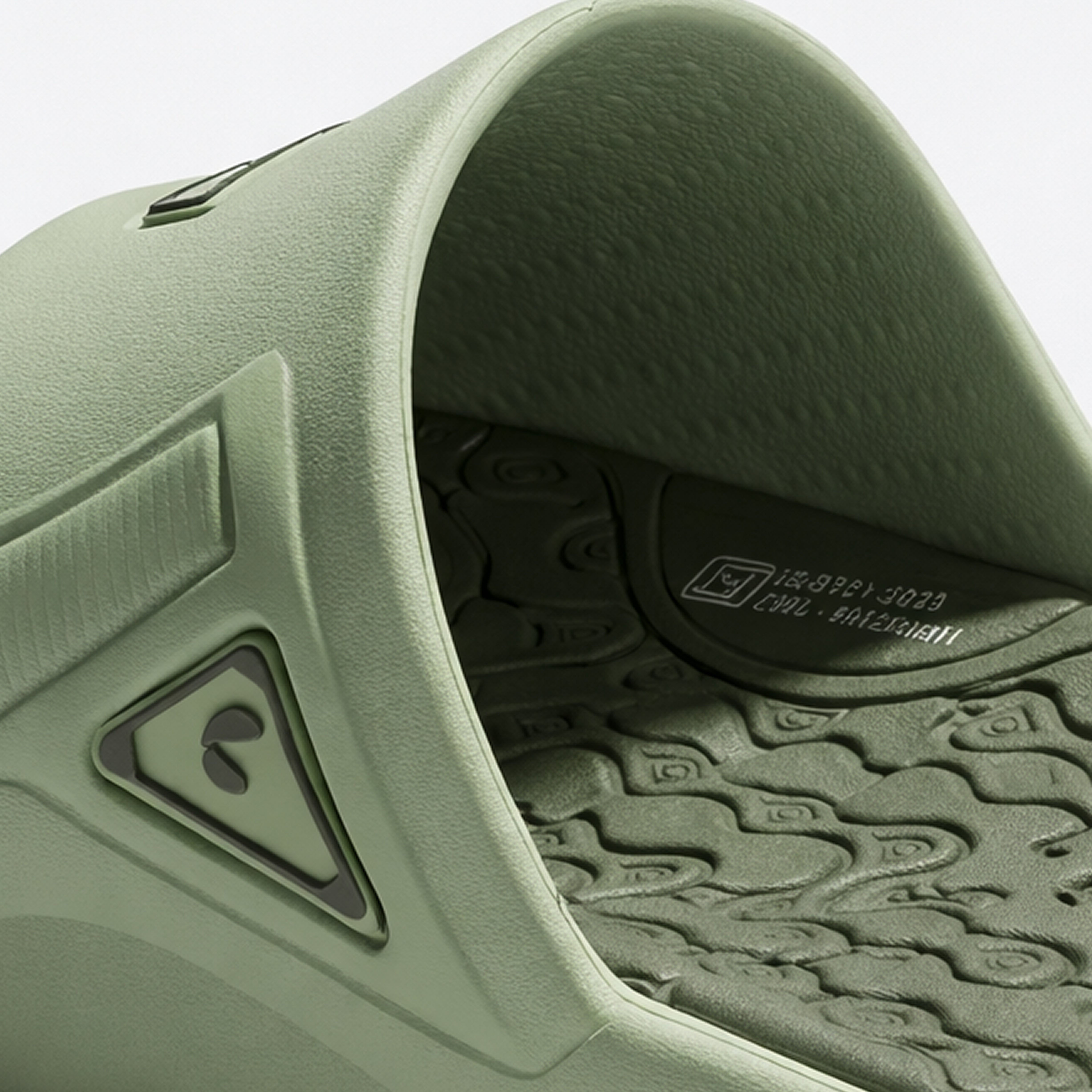 Close-up of a Chupps green slip-on shoe with brand logo and textured sole.